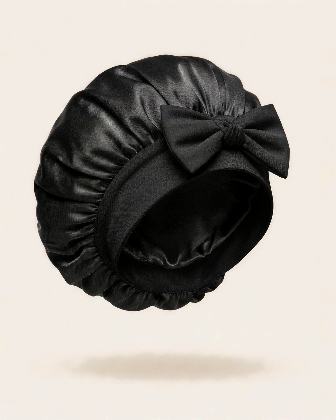Black silk bonnet with a mulberry silk crown and soft band