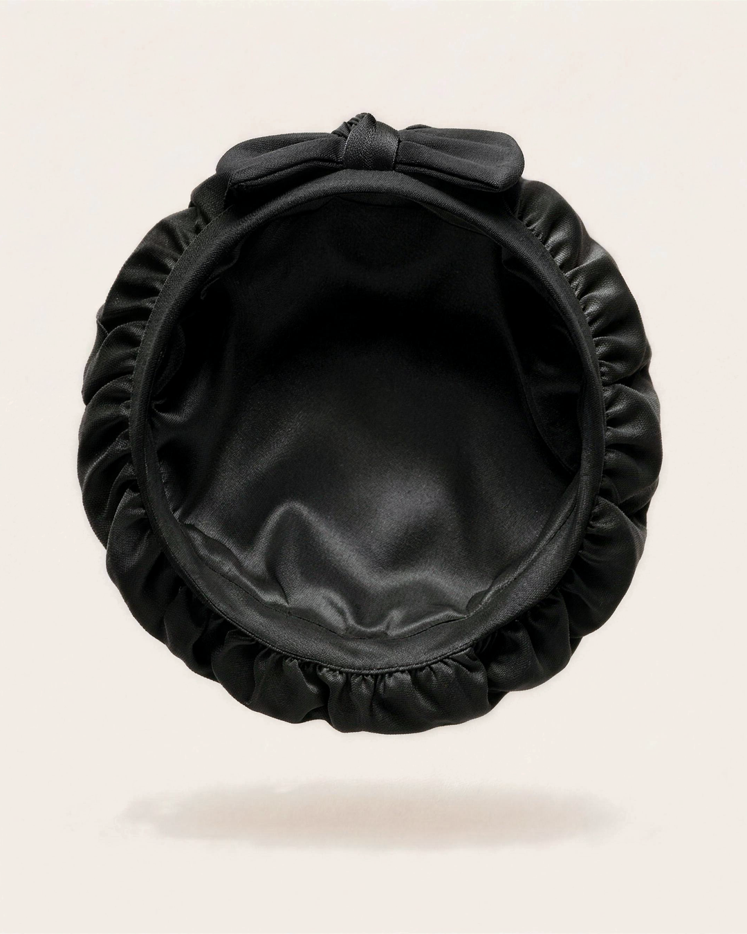 Inside of the black silk bonnet, showing the silk lining