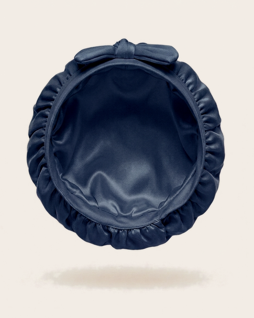 Inside of the navy silk bonnet, showing the silk lining