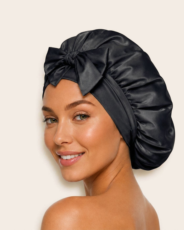 Model wearing the black silk bonnet