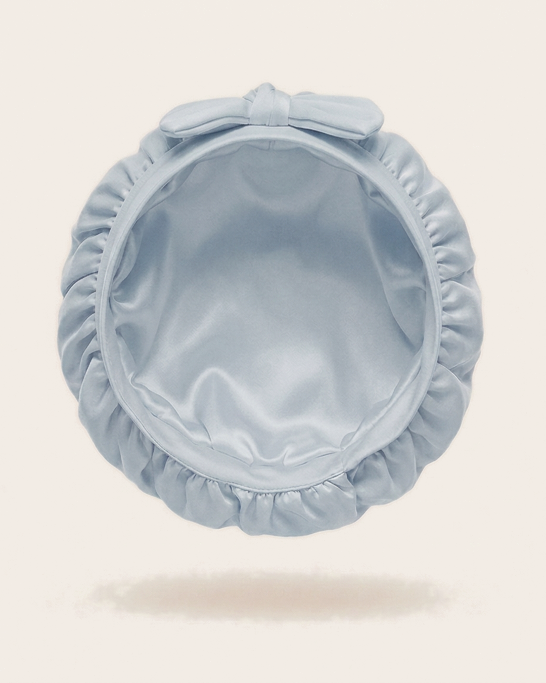 Inside of the blue mist silk bonnet, showing the silk lining