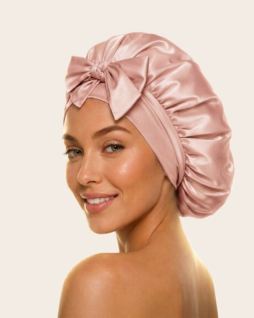 Model wearing the pink silk bonnet