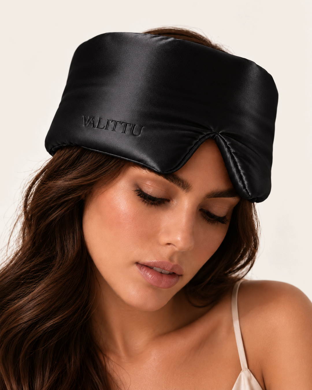 Model wearing the black silk sleep mask