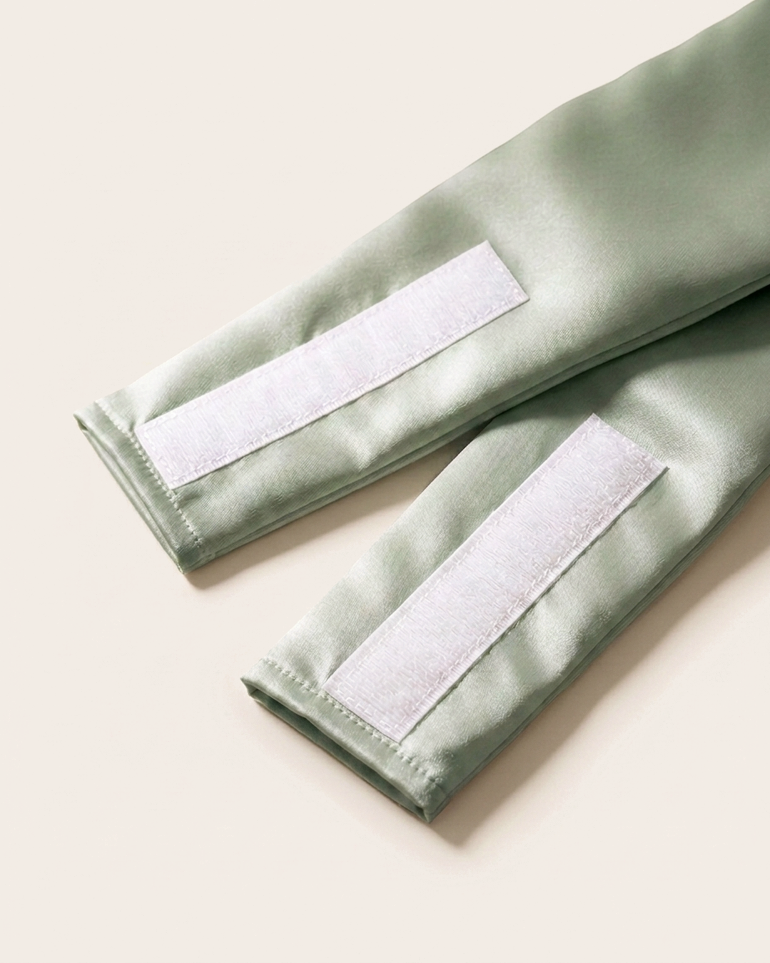 Close-up of the wide silk strap and soft velcro closure on the green mist sleep mask