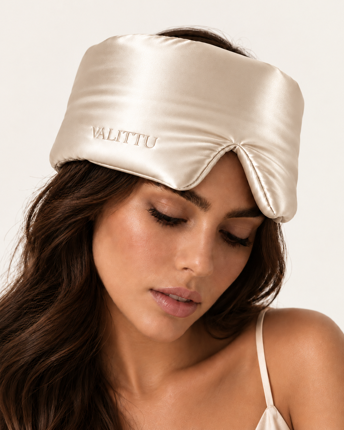 Model wearing the ivory silk sleep mask